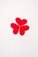 Red and pink hearts are folded into a figure or pattern. Festive greeting card for Valentine's Day....