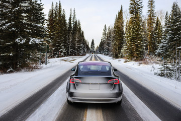 Electric car driving, mountains snow