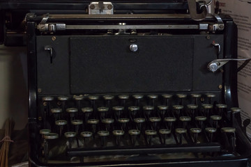 Grodno, Belarus, January 16, 2019: Old typewriter continental. German quality. Located on the shelf next to the books. Keys close up. Antiques, historical value.