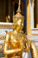 Statue of a kinnara in the temple of the Emerald Buddha, Wat Phra Kaew in Bangkok Thailand.