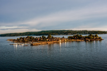 small cozy island in oslo inlet at dusk