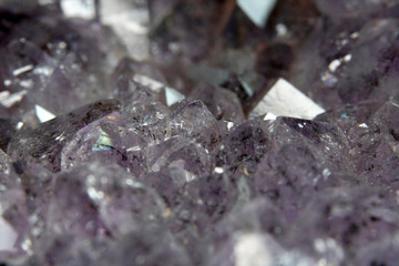 Quartz also called deep quartz with mineral inclusions in the studio in front of black background photographed in Marco mode 