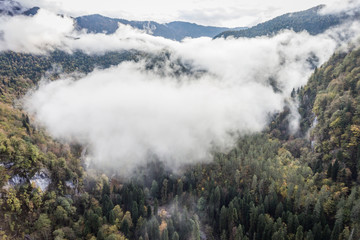 Beautiful mountains in the clouds. Aerial