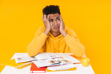 Desparate african teenager boy studying