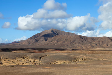 Volcanic landscape of Lanzarote, Canary Islands, Spain, dramatic scenery painted by sand, rocks .