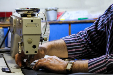 old sewing machine and tailor