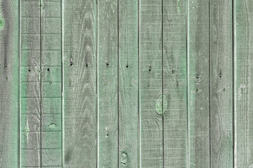 Nailed wooden planks. Old green fence. Empty background with wood texture, for website or layout.