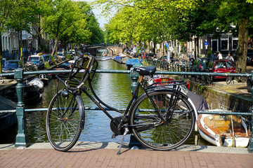 Fototapeta na wymiar Bike on bridge over canal
