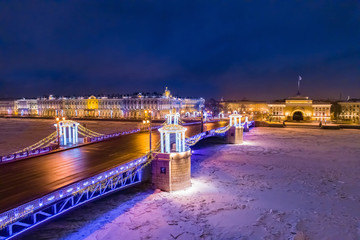 Saint Petersburg. Russia. Christmas in Petersburg. Palace bridge decorated for the New year. Festive evening in the city. Bridges Of Petersburg. Hermitage. Admiralty. Festive garlands on the bridge.
