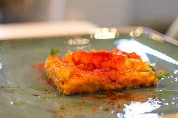 detail of saffron risotto dish with chilli in a luxury Italian restaurant - 309275172