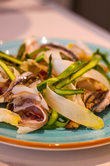 Plate of raw white and green asparagus passed in emulsion of anchovies, with capocollo from Benevento and anchovies from Menaica. Crunchy and savory at the same time.