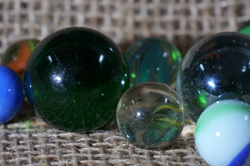 Colorful glass balls photographed in studio on pad with macro