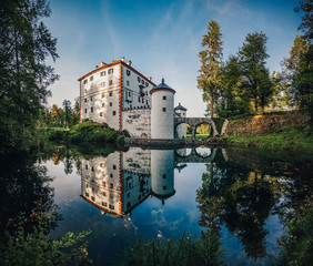 Famous 13th century Sneznik Castle (Grad Snežnik, Schloß Schneeberg), Slovenia. State castle Sneznik reflecting in a beautiful pond. Loška Dolina, Slovenia. © Ondra