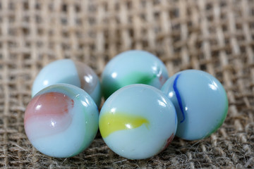 Colorful glass balls photographed in studio on pad with macro