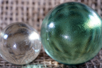 Colorful glass balls photographed in studio on pad with macro