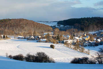 A view of a beautiful day over  a Bavarian village at winter time 