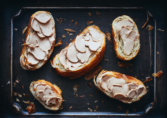 Croissant toast with duck foie gras mousse top view