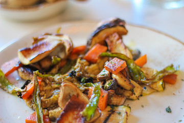 creative autumn dish with roasted eggplant, candied pumpkin, marinated scapece courgette, fried fry of Penta di Frisciano, sautéed porcini mushrooms and sage