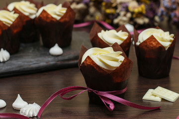 Homemade cupcakes with cream on a dark background, Concept for Valentine's Day, Birthday and Father's day