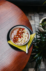 Healthy oat meal with cocoa, bananas and goji berries. 