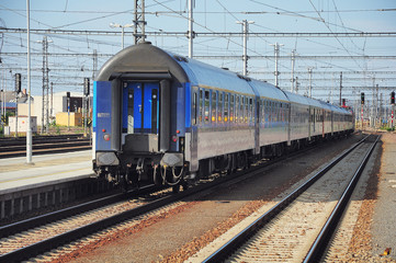 Fototapeta na wymiar Passenger train departs from the platform. Czech Republic.