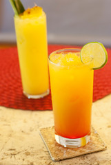 Summer fruite cocktail with lemon garnish