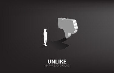 Silhouette businessman standing with 3D thumb down icon. concept of customer disappointment , client rating and ranking.