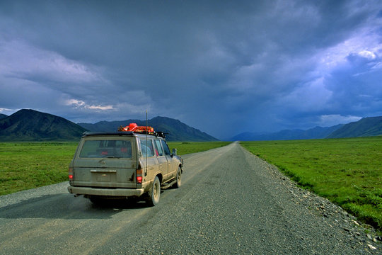 Heading north to Inuvik on The World Famous Dempster Highway, NWT, Canada. Only one truck seen all day.  The road is gravel and dirt because heaving by permafrost would destroy roads made of pavement 