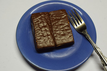 slice of cake on a plate with fork and knife