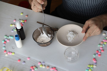 Polymer clay at home. Men's hands are doing an experiment. Family fun. DIY concept.