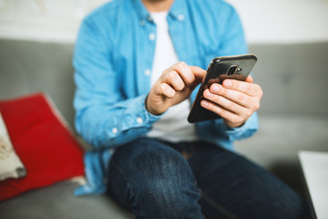 Close up shot of man hands using smartphone