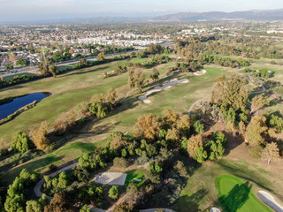 Aerial view over golf field. Large and green turf golf course in South California. USA