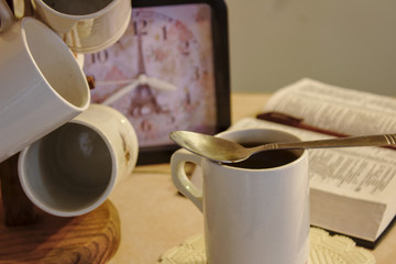 Fototapeta na wymiar Enjoying reading with a cup of coffee