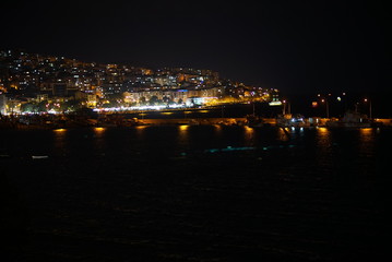 night views in the port city.small fishing boats in the harbor, the seashell reflecting on the sea