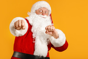 Funny drunk aggressive Santa Claus on color background