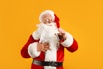 Funny drunk Santa Claus on color background