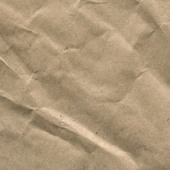 Fototapeta na wymiar Macro photo, texture of crumpled brown craft paper close-up. Paper background