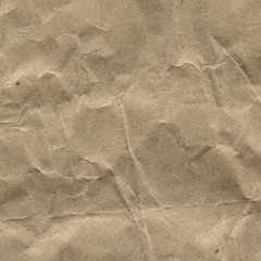 Macro photo, texture of crumpled brown craft paper close-up. Paper background