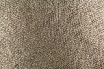 The texture of gray fabric with interweaving threads. Background.