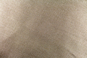 Fototapeta na wymiar The texture of gray fabric with interweaving threads. Background.