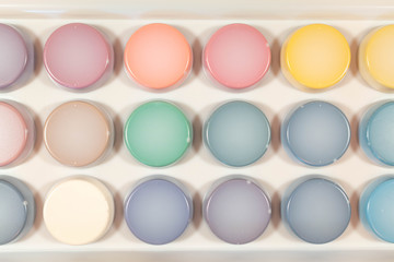 A new box with multi-colored paints for painting on the back. For the whole photo