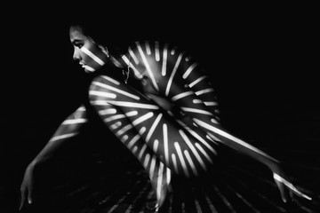 black and white nude art portrait of asian woman with strip of shadow on body