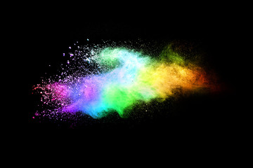 Fototapeta premium Explosion of colored powder isolated on black background. Abstract colored background. holi festival.