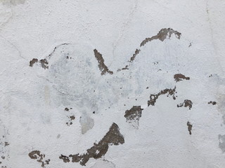 Old wall background - city building decay texture. Urban decline pattern with peeling paint.