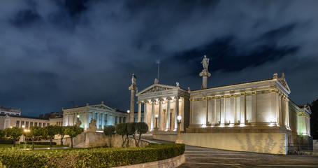 Naklejka premium Panoramic view of The National Academy of Athens - Akadimia Athinon at night, Athens, Greece.