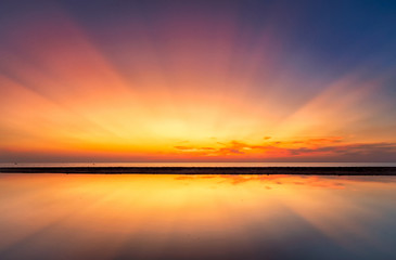 Abstract Amazing Colorful sky with sunset view in the evening or sunrise and clouds background with Reflection in water in the nature background concept.