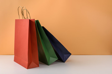 mockup of blank craft package or colorful paper shopping bag with handles