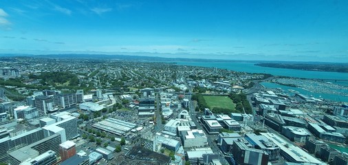 Viaduct Harbour, Auckland / New Zealand - December 13, 2019: The timelapse and general skyline of Auckland city, seen from the top of the landmark Sky Tower