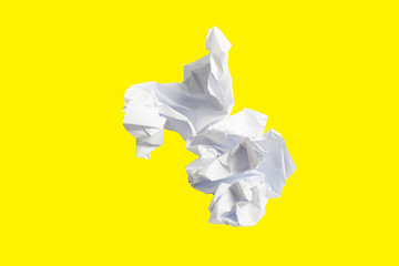 Crumpled paper isolated on yellow background