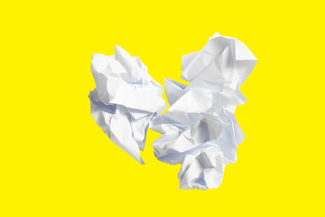 Crumpled paper isolated on yellow background